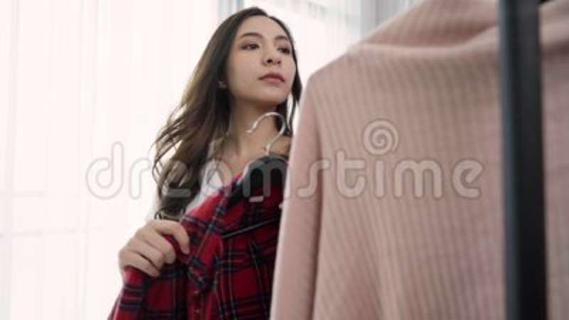 Asian female changing clothes