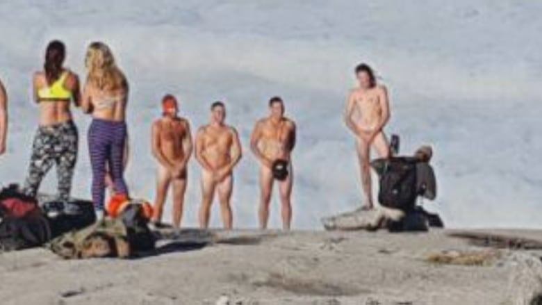 Group stuck naked together